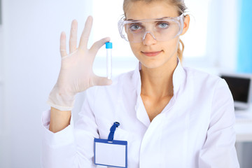 Female scientific researcher or blood test assistant in laboratory. Medicine concept