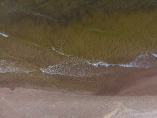 Fototapeta premium top view on brilliant sea and sand coastlake