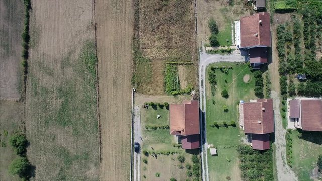 Top View of Houses and Farm Land in a Small Town in the Balkans