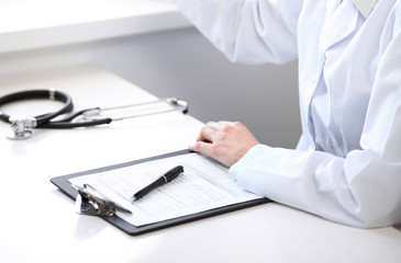 Stethoscope lying at the desk. Medicine or pharmacy concept. Medical tools at doctor working table