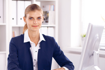 Business woman or secretary at work in office
