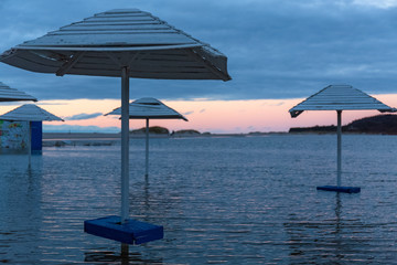 Flooded area of a summer cafe on the Baltic seashore.