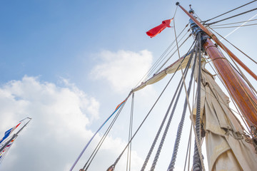 Rigging of a tall ship in a port in sunlight in spring