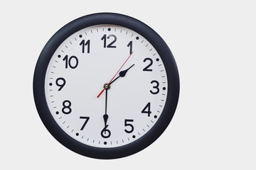 Time concept with black clock at  half past one