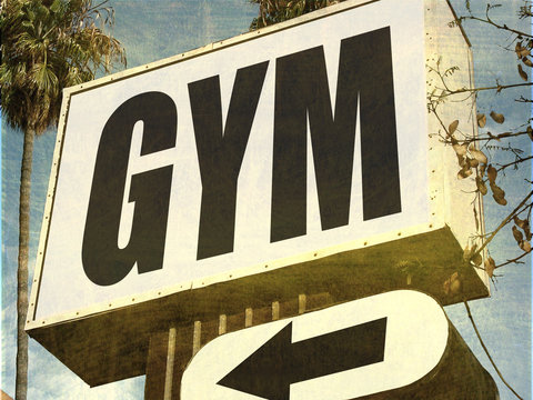 aged and worn gym sign
