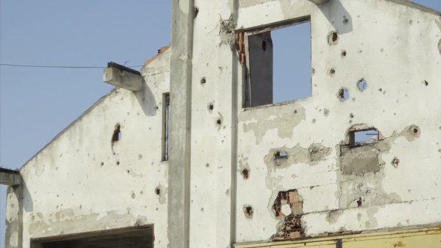 Close Up of a White Building Damaged From War in Kosovo