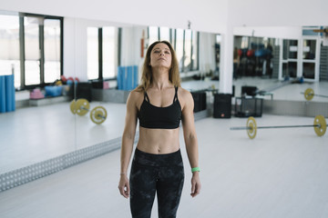 Fototapeta premium Close up image of attractive fit woman in gym