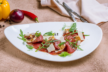 thinly sliced meat with red wine