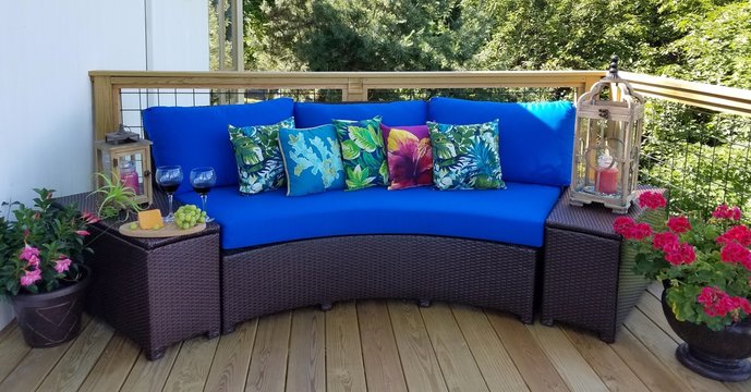 Circular Sofa with Caribbean Blue Cushions and Matching Throw Pillows; Side Serving of Red Wine, Grapes and Cheese on Table; Travel, Tourism, Relaxation, Villa, Exclusive Ideas