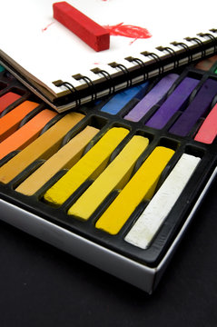 Colorful Pastel Crayons and Book