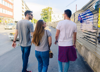 Obraz premium Three Friends Walking Outdoor And Having Fun