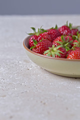 Bowl of Fresh Ripe Strawbrries on Bright Background