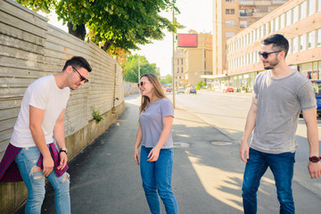 Three Friends Walking Outdoor And Having Fun