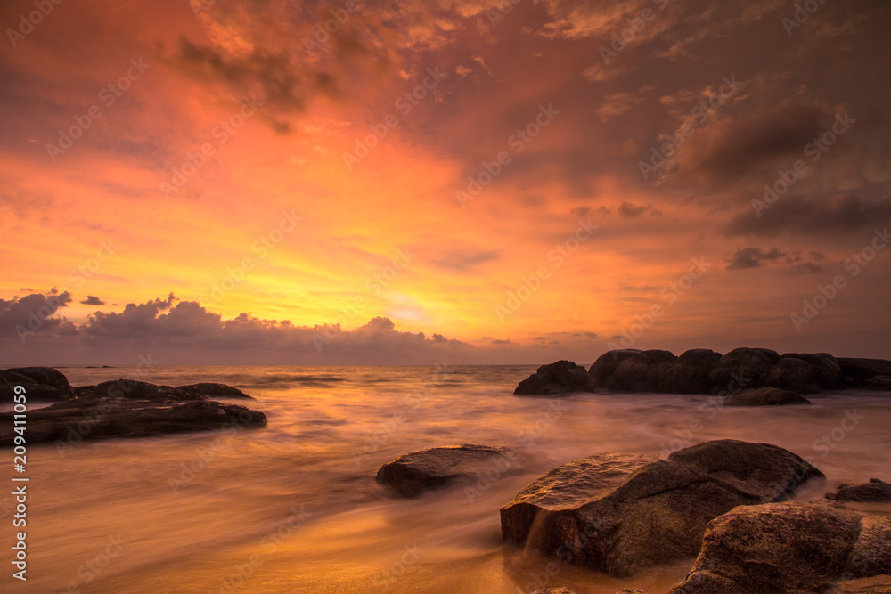 Wall mural Golden light at the beach 