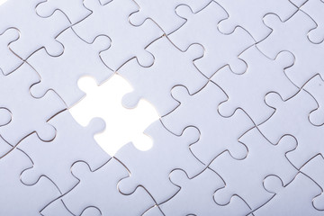 Pattern of jigsaw puzzle and one of missing hole