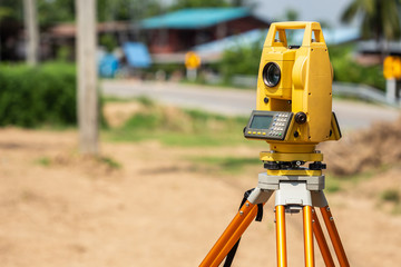 Surveyor engineer making measure at the land