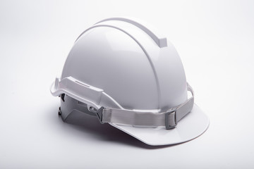 White safety helmet construction on white background.