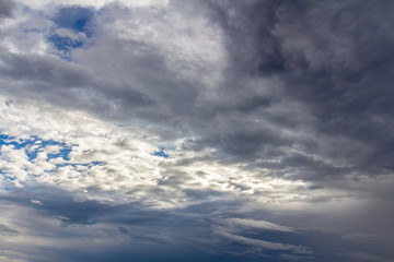 Dark blue stormy cloudy sky natural photo background