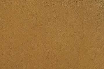 オレンジのモルタル壁