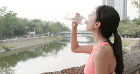 Woman drink of water at park