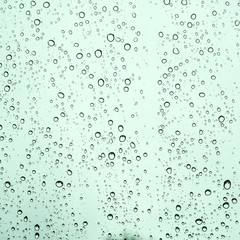 Raindrops on glass car texture.