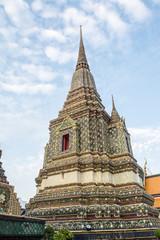 Fototapeta premium Pagoda is in Wat Pho that was named as the temple of the pagoda or chedi that are decorated with yellow glaze or glazed tiles or dark blue. 