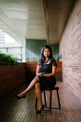 Corporate portrait head shot of a confident and attractive Indian Asian business woman. 