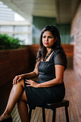 Corporate portrait head shot of a confident and attractive Indian Asian business woman. 