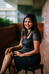 Corporate portrait head shot of a confident and attractive Indian Asian business woman. 