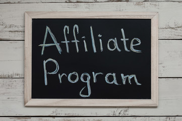 Affiliate Program concept. Affiliate marketing. Blackboard with handwritten text, top view