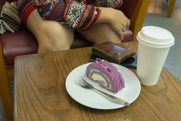 cake and paper cup fo coffee on table wood