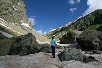 Young female tourist in the Caucasus mountains
