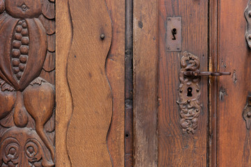 church brown wooden door with handles details