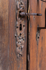 church brown wooden door with handles details