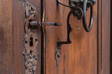 church brown wooden door with handles details