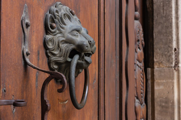 church brown wooden door with handles details