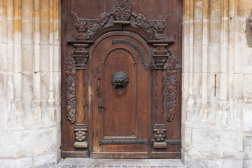 church brown wooden door with handles details
