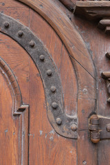 church brown wooden door with handles details
