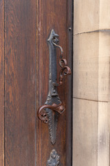 church brown wooden door with handles details