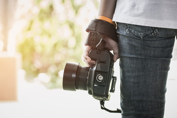 Professional photographer landscape with dslr camera in smart woman hands for ready to take pictures, Photographers takes snapshots for pleasure to remember events, vintage tone