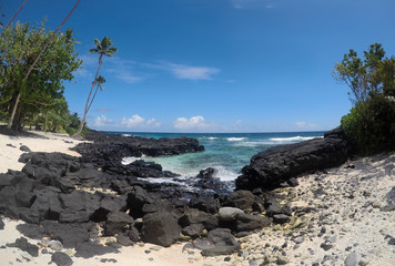 Fototapeta na wymiar Rocky beach with clear sea water at Lefaga, Matautu, Upolu Island, Samoa, South Pacific