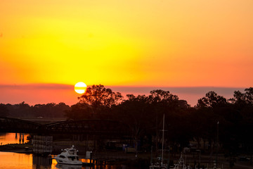 Sunset over traffic bridge in a regional town