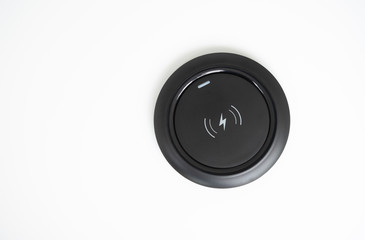 Black Wireless charger on the white screen