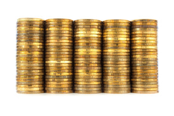 Stacks of golden coins on white background.