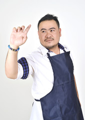 Asian entrepreneur fat man touching an imaginary button virtual screen standing on white background 