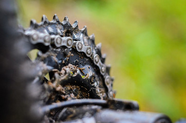 Mountain Bike Transmission in Mud. Dirty Chain Drive of Mountain Bike After Riding in Bad Weather