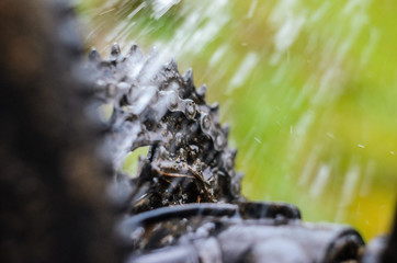 Washing the Transmission of a Mountain Bike with a Water Jet, Close-Up.