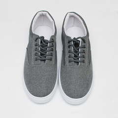 Sneakers gray color on a white background