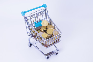 shopping cart with euro coins, concept of economy and business