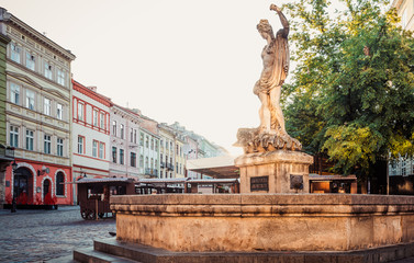 Fototapeta na wymiar Amphitrite fountain on Market square in Lviv. 